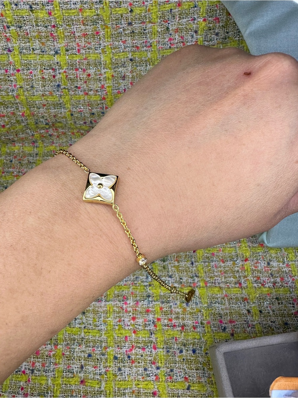 AA greatGold Plated Adjustable Bracelet with White Mother-of-Pearl Flower Accent